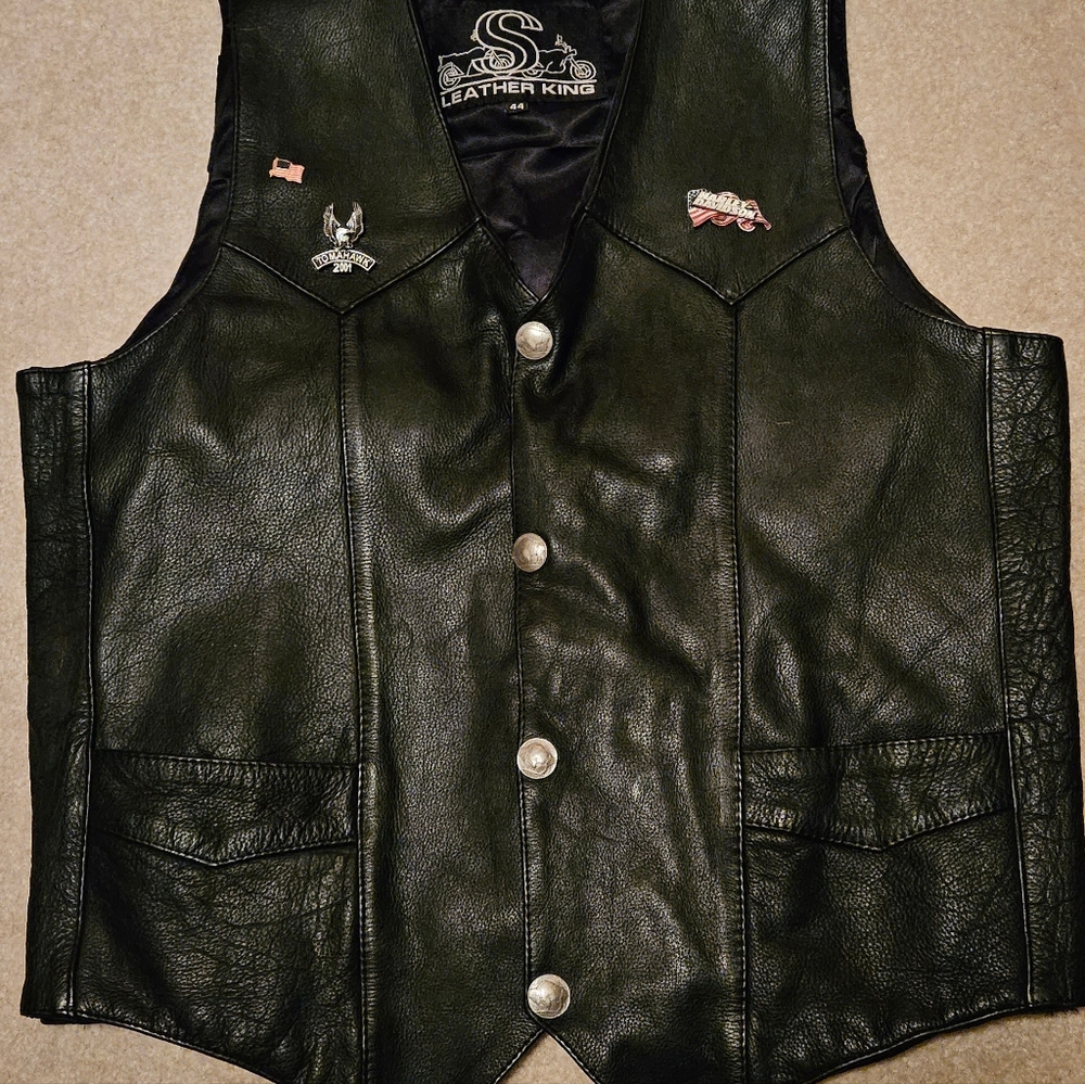Leather King biker vest with pins